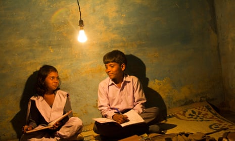 Light fantastic … young students in rural India settle in for a night’s reading beneath an overhead light