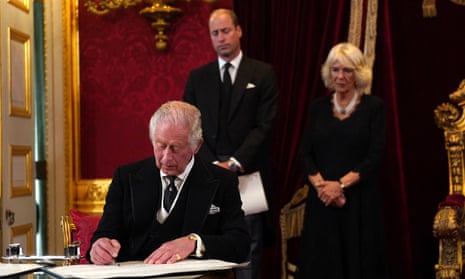 King Charles III signs an oath to uphold the security of the Church in Scotland during his proclamation as King during the accession council on September 10, 2022 in London.