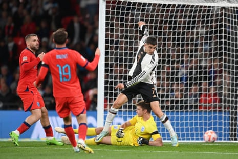 Kai Havertz of Germany scores their side's third goal past Nick Pope of England.