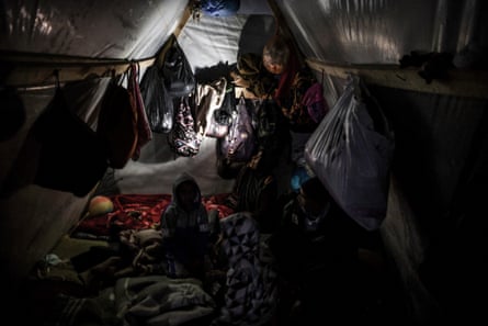 A Palestinian child sheltering in a tent.