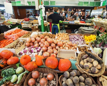 a myriad of vegetables on sale at a stall in the Marché des Enfants Rouges in Paris