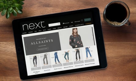 An iPad showing All Saints jeans on the Next website