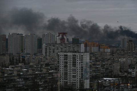 Smoke rises above residential buildings
