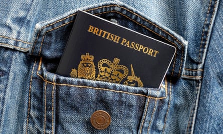 British passport in a blue denim jacket pocket