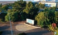 aerial view of trees and sign with blue logo