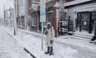 At least two killed after spring storm dumps snow on US north-east