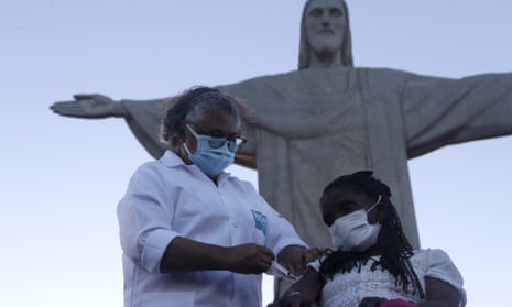 Terezinha da Conceicao, 80, is the first woman in Brazil to receive the Covid-19 vaccine produced by China’s Sinovac Biotech Ltd, during the start of the vaccination programme which was launched in front of the Christ the Redeemer statue, Rio de Janeiro.