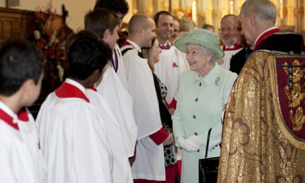 Queen Elizabeth II is greeted by members of the choir at the Savoy chapel in 2012