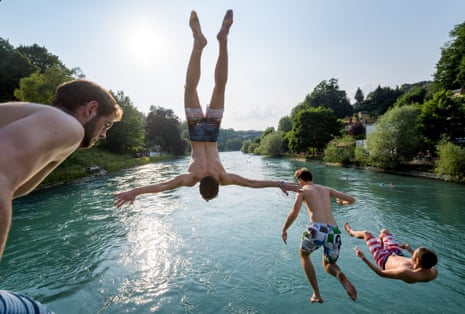 - Young men jump into the river Aare on June 21, 2017 in Bern