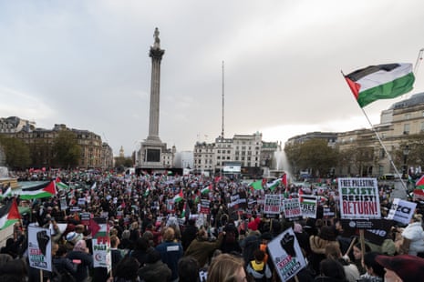 People gather as they carry Palestinian flags and banners to demonstrate solidarity with the Palestinians and demand an immediate ceasefire at Trafalgar Square in London, United Kingdom on November 04, 2023.