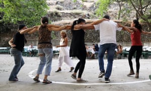 locals and tourists dancing at the panegyri.
