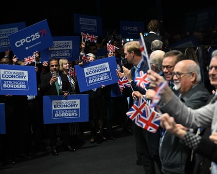 Supporters wave placards and union flags