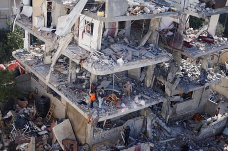 Palestinians inspect the site of an Israeli strike on a house in Rafah in the southern Gaza Strip, an area where Israel’s miliatry has repeatedly ordered Palestinians to move to for safety.