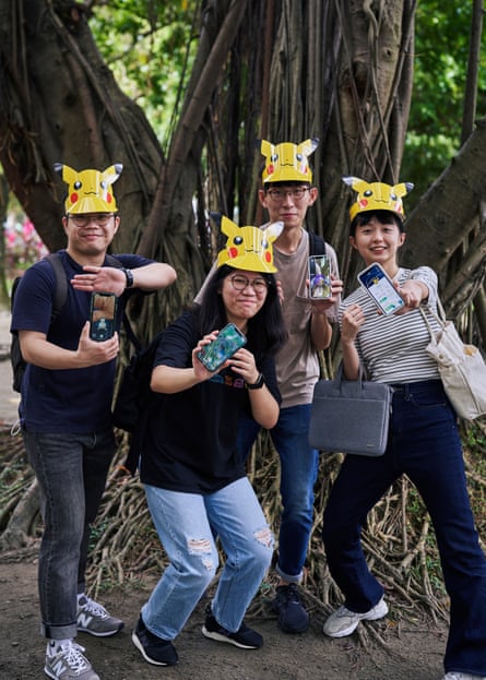 Zhi Shao Lau, Yi Xuan Lin, Kevin Tien and Joanne Luo show off their Pokémon catches.