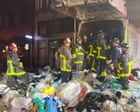 San Francisco fire officials rescue man trapped inside garbage truck