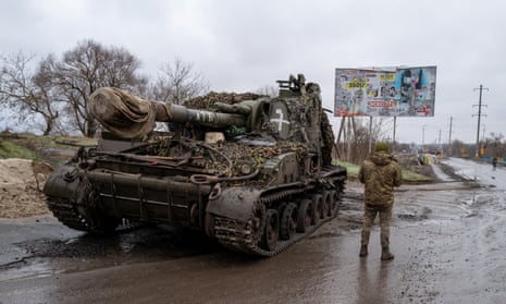 A Ukrainian tank on a street in Kupiansk, a town regularly hit by Russian shelling, amid Moscow’s unilateral 36-hour ceasefire