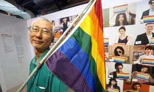 Chi Chia-wei holds a rainbow flag during an anti-homophobia exhibition in Taipei.