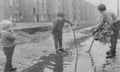 Children playing in puddles in the Gorbals district of Glasgow in 1969.