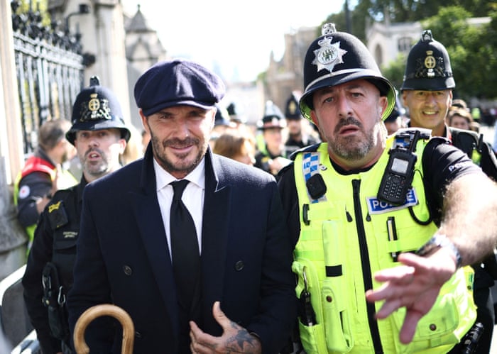 David Beckham and a policeman.