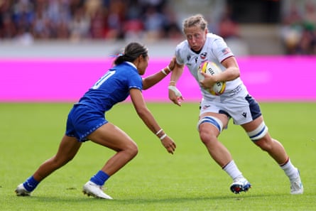 Kate Zackary, wearing a white US Eagles uniform, runs with the ball during a game at the 2025 Rugby World Cup.