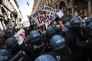 Turin, Italy. A bottle flies through the air as riot police clash with protesters of the No TAV movement, during one of several demonstrations against unemployment