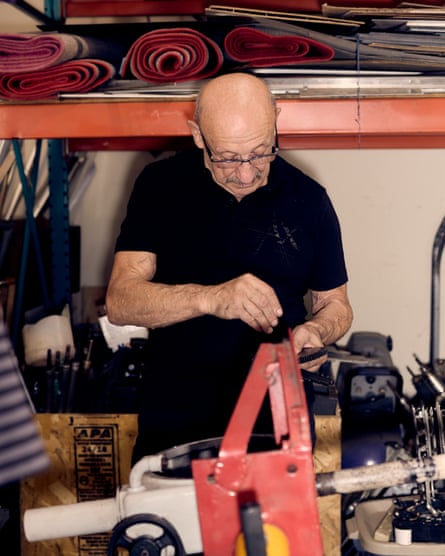 a man works on photo booth repairs