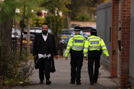 Metropolitan police officers on patrol in the Orthodox Jewish communities in Stamford Hill, north London on Friday.
