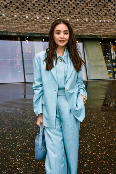 A person wearing a light blue suit