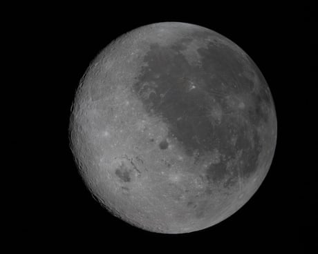 The moon, with areas of light and shade on its surface