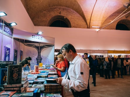 People look at books on display