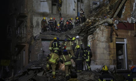 Rescuers work at the site of a residential building damaged by a Russian missile in Kryvyi Rih, Ukraine.