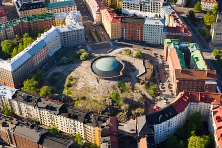 Aerial view of a mound of rock with dome at its centre