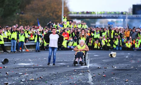 Protesters face riot police as they block a motorway in Virsac, near Bordeaux, November 2018