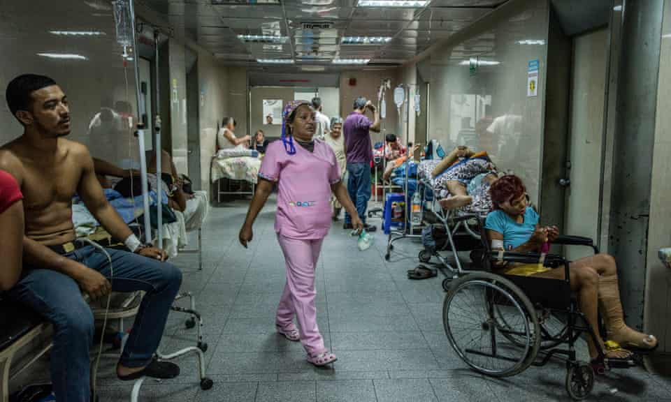 Patients awaiting emergency care fill a hallway at Luis Razetti Hospital in Puerto la Cruz, Venezuela.
