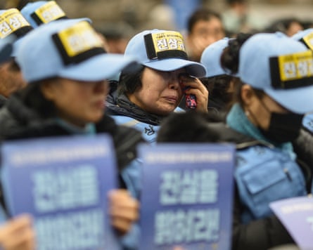 A woman cries as she and other families of victims of the Air Jeju crash gather at a rally in Seoul on Saturday
