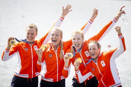 Marloes Oldenburg and Dutch women’s four teammates celebrate with their gold medals.