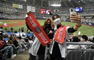 KT Wiz fans take a selfie during the first baseball game of the Korean Series between Doosan Bears and KT Wiz at Gocheok Skydome