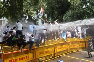 Delhi,India. Police use water cannon to disperse Indian Youth Congress workers during a protest march to Indian parliament against Bharatiya Janata party (BJP) led central government policies, including new agricultural laws, the Pegasus snooping row, unemployment, inflation and the handling of the pandemic