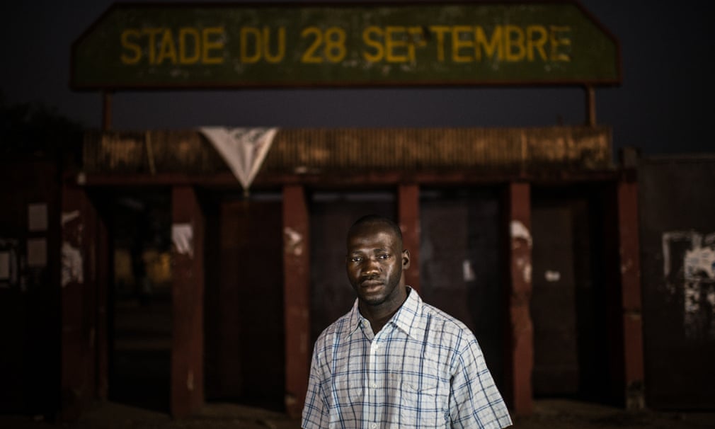 Mamadou Taslima Diallo, photographed at the entrance to the stadium where he was beaten by police.