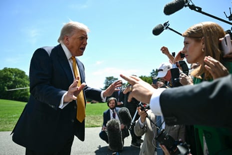 US president Donald Trump speaks to the press before departing for China.