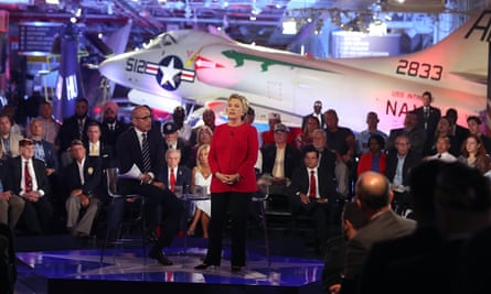 Matt Lauer looks on as Hillary Clinton speaks during the NBC forum in Manhattan on Wednesday night.