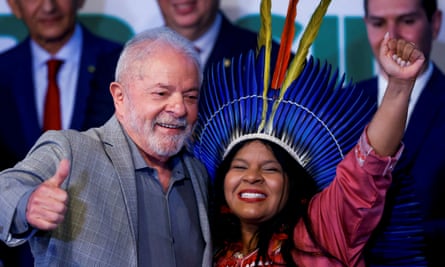 Brazilian President-elect Luiz Inácio Lula da Silva stands next to Sonia Guajajara, nominee for minister of Indigenous Peoples