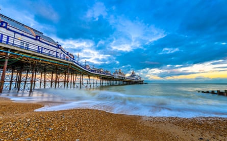 Eastbourne Pier and beach at sunset