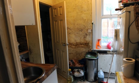 The kitchen of a rented property in Newham. The door leads to the toilet and shower, also in state of disrepair.