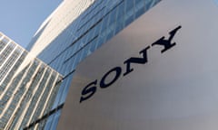 Silver sign with Sony logo in front of buildings
