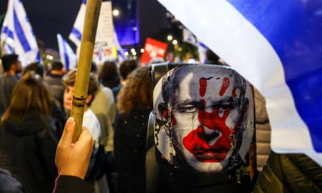 People showing their support for the hostages as they march through Tel Aviv in a protest against the Israeli government on 21 December 2024.