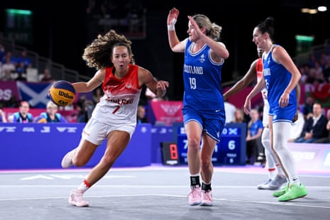 England’s Georgia Gayle attempts to get past Scotland’s Ella Doherty.