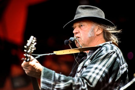 Neil Young singing on stage