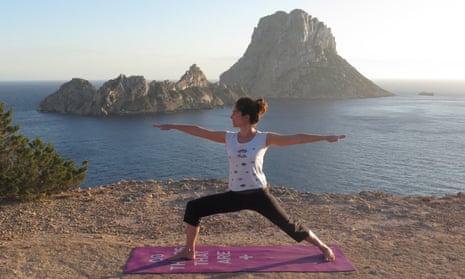 Jane on a sunset yoga session, with magnetic Es Vedrà in the background.
