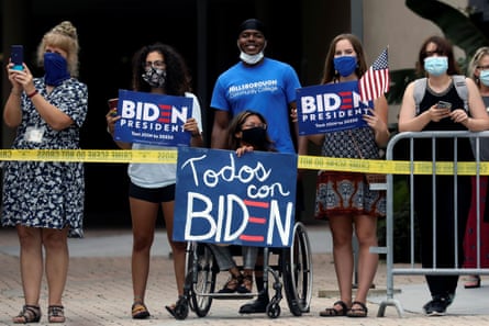 Joe Biden delivers remarks and holds a roundtable discussion with veterans at Hillsborough Community College in Tampa, Florida, as his supporters stand outside on 15 September.